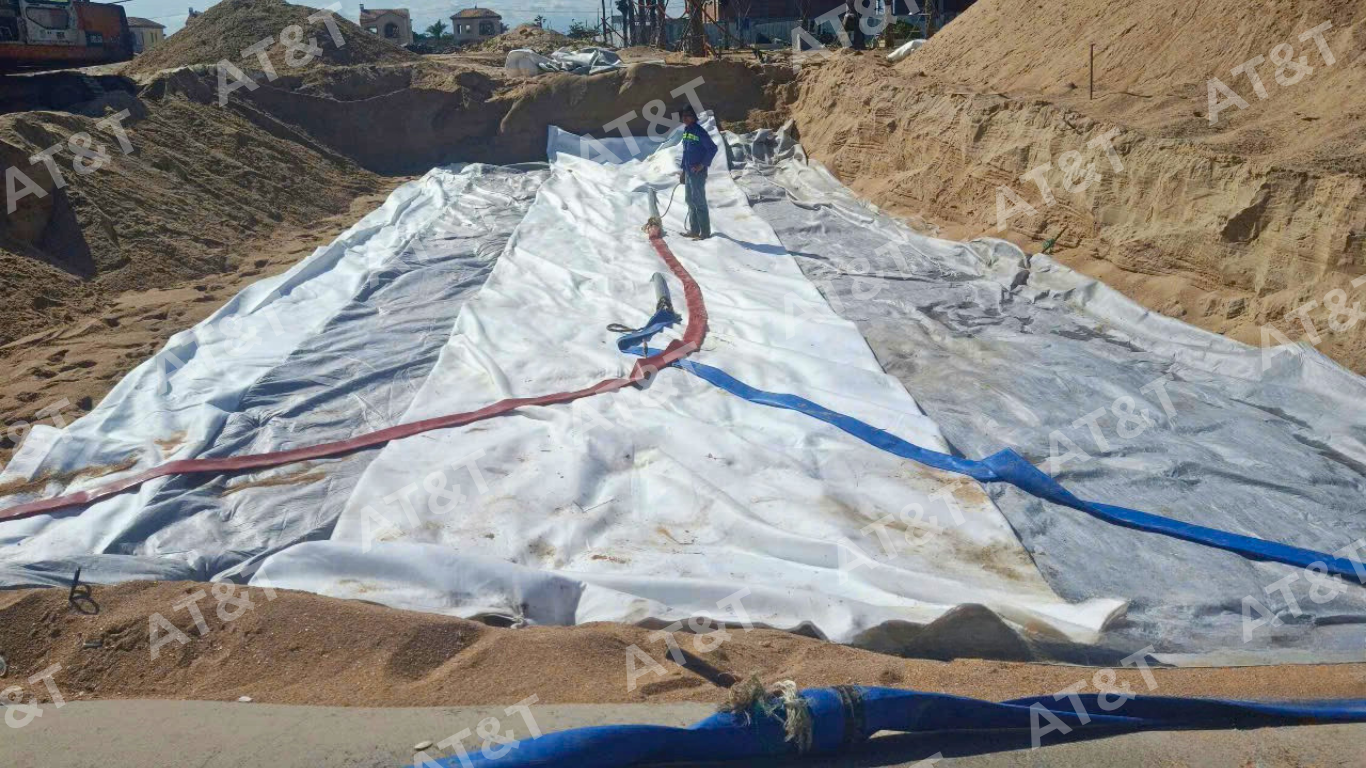 Thi công lớp lót chống xói bằng ống địa kỹ thuật làm đê lấn biển